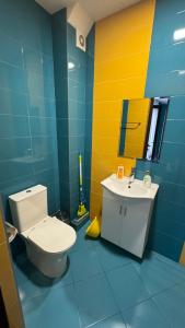 a bathroom with a toilet and a sink at Hotel17 in Belogradchik