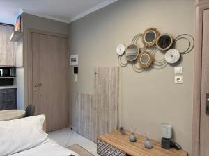 a room with a table and plates on the wall at Bloom Garden 1 in Mytilene