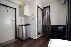 a room with a bed and a mirror at Central Shinjuku, Quiet Area, Close to Station, No Stairs, Room101 in Tokyo