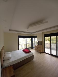 Ένα ή περισσότερα κρεβάτια σε δωμάτιο στο Koru Villa,3 Oda 1 Salon,Muhtesem Manzara ve Konum,Ozel Havuz +25 φωτογραφίες