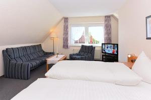 Postel nebo postele na pokoji v ubytování Hotel garni Poggenstool