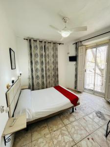 Ένα ή περισσότερα κρεβάτια σε δωμάτιο στο Pensión Rivera