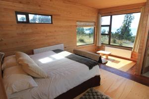 Voodi või voodid majutusasutuse Refugio Pullao toas