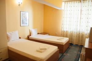 Postel nebo postele na pokoji v ubytování Hotel Ertancom