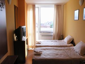 Postel nebo postele na pokoji v ubytování Hotel Ertancom