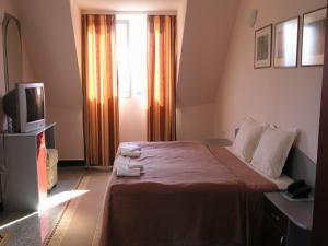 Postel nebo postele na pokoji v ubytování Hotel Ertancom
