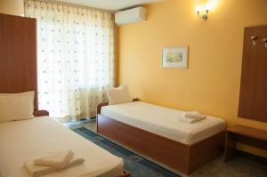 Postel nebo postele na pokoji v ubytování Hotel Ertancom