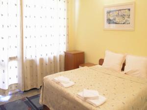 Postel nebo postele na pokoji v ubytování Hotel Ertancom