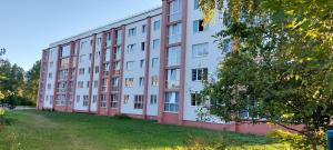 a large apartment building with red and white at Designer Apartment in Roja