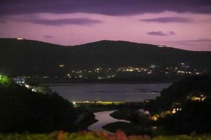 a view of a river at night with a city at Knysna - Views Views Views! in Knysna