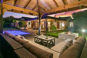 an outdoor patio with a couch and a table at Knysna - Views Views Views! in Knysna