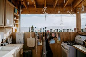 a kitchen with utensils hanging on a wall at Cozy Glamping Pod for a Nature Escape in Monticello, Utah in Monticello