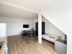 a bedroom with a bed and a desk in a room at City Appartement in Gelsenkirchen