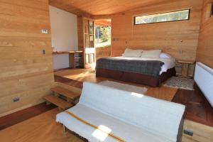 Voodi või voodid majutusasutuse Refugio Pullao toas