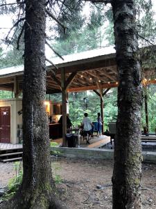two people sitting at a table in a house at Alaskan Yurt Glamping, Perfect for a Couples Getaway in Seward +6 photos
