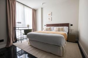 Postel nebo postele na pokoji v ubytování My Suite Madrid