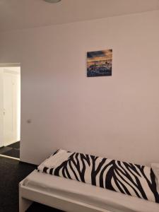 Postel nebo postele na pokoji v ubytování BigCitty Rooms