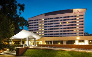 a hospital building with a lit up building at Qubus Hotel Legnica in Legnica