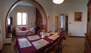 a living room with a table and a couch at La Rosa Bianca in Tornolo