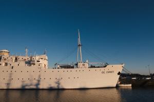 a large white ship sitting in the water at Riverfront Stylish Apartment - waterfront 2BR in Viana do Castelo