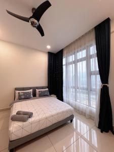 a bedroom with a bed and a ceiling fan at Muji Style Luxury Two Bedrooms Condo 1-7pax at D Secret Garden - Johor Bahru-Mid Valley-Paradigm Mall-Dato Onn-Setia Tropika-Kempas-UTM in Johor Bahru +15 photos