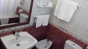 Koupelna v ubytování Hotel Riavela