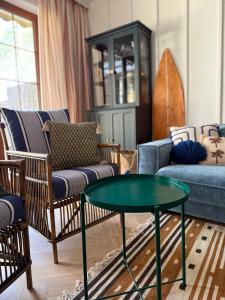 a living room with a couch and a table at Sea You Beach House in Rogowo