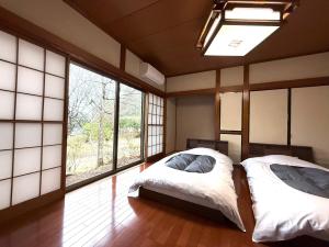 Postel nebo postele na pokoji v ubytování 楓リゾート鬼怒川温泉 优雅宽敞的日式独栋旅馆