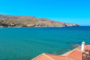 a view of the ocean from the roof of a house at Chic Magnificent Sea View Suite in Andros