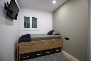 Ένα ή περισσότερα κρεβάτια σε δωμάτιο στο Apartamento Moderno a 5 min del Funicamp, 1-2