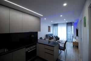 Dapur atau dapur kecil di Apartamento Moderno a 5 min del Funicamp, 1-2