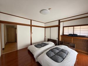 Postel nebo postele na pokoji v ubytování 楓リゾート鬼怒川温泉 优雅宽敞的日式独栋旅馆 + 37 fotografií