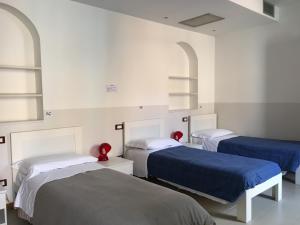 Un pat sau paturi într-o cameră la L'Archetto