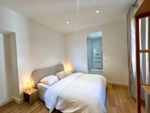 Postel nebo postele na pokoji v ubytování Apartment - La Isla - Seafront