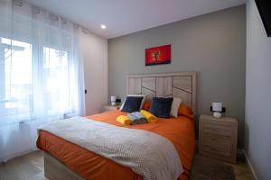 Ένα ή περισσότερα κρεβάτια σε δωμάτιο στο Apartamento Moderno a 5 min del Funicamp, 1-2