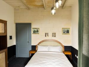 Postel nebo postele na pokoji v ubytování Il Bekka Suites