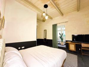 Letto o letti in una camera di Il Bekka Suites