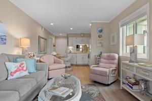 a living room with a couch and chairs and a table at Southwinds J12 condo in Atlantic Beach