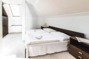 Postel nebo postele na pokoji v ubytování Hotel Bohemia
