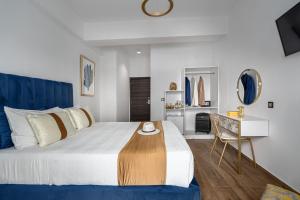 Posteľ alebo postele v izbe v ubytovaní MR P. Boutique Residence