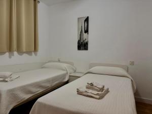 Posteľ alebo postele v izbe v ubytovaní Apartamentos Amatista