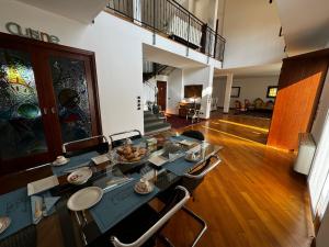 a living room with a dining table and chairs at Antico Borgo di Liteggio in Cologno al Serio