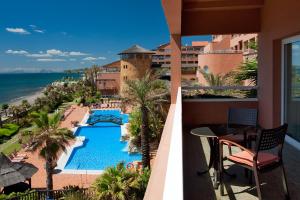 a view of the pool from the balcony of a resort at Elba Estepona Gran Hotel & Thalasso Spa in Estepona