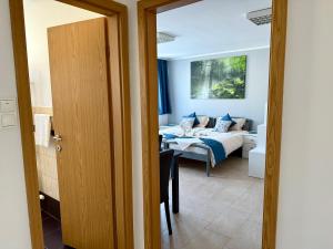 a bedroom with a bed and a bed and a room at Miyabi 1 in Maribor