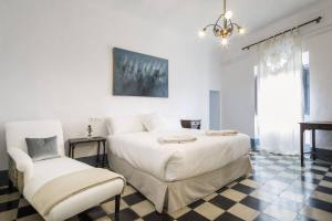 Łóżko lub łóżka w pokoju w obiekcie La Casa Grande de Zujaira