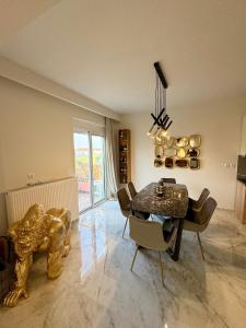 a living room with a table and a lion statue at Rhodes Villa 365 in Rhodes Town +20 photos