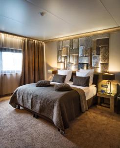 Postel nebo postele na pokoji v ubytování Thermen Londerzeel Hotel