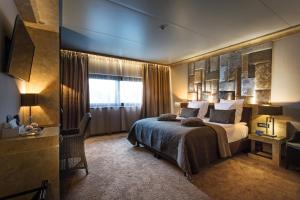 Postel nebo postele na pokoji v ubytování Thermen Londerzeel Hotel