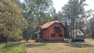 a small house in the middle of a field at Vila Limun in Divčibare