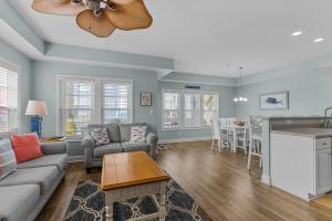 a living room with a couch and a table at Slack Tide condo in Atlantic Beach